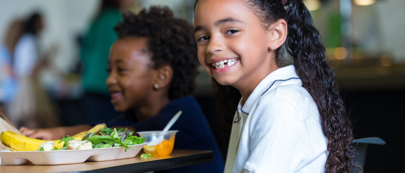 Girl eating nutritious school lunch