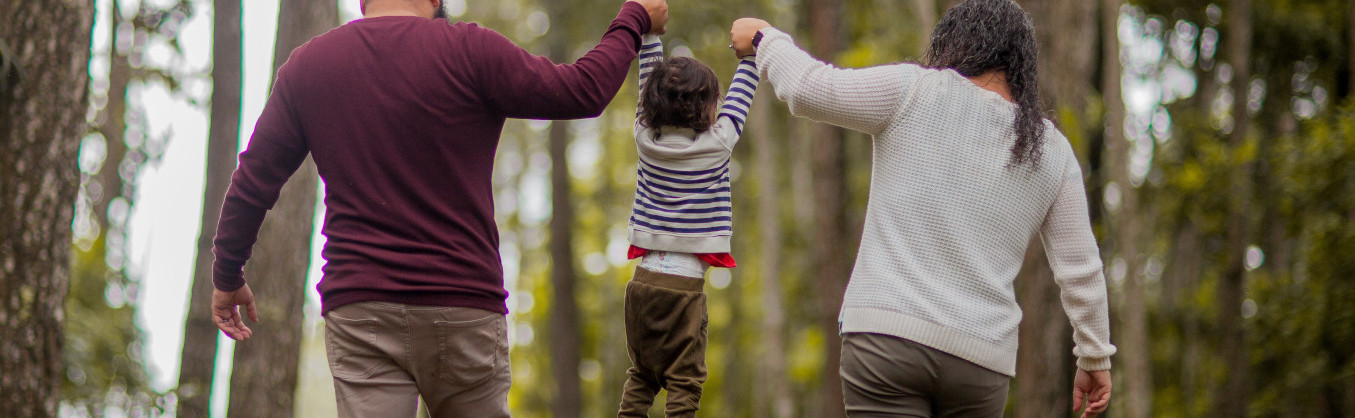 Family walking in the woods