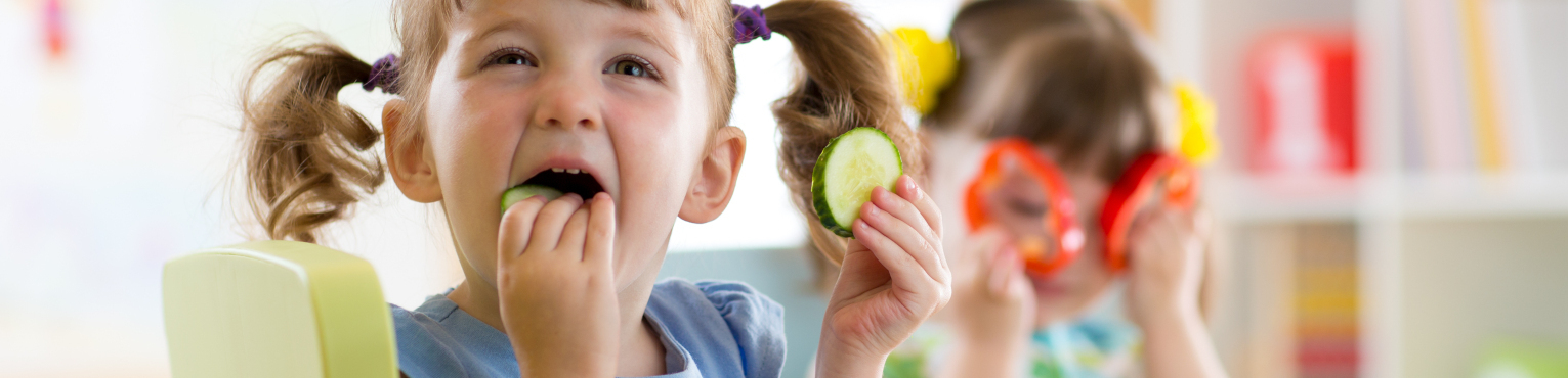 Girl eating cucumber